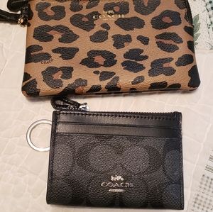 Coach card holder and wristlet wallet.